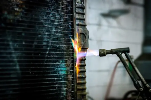 soldering a copper-brass radiator tank to the core